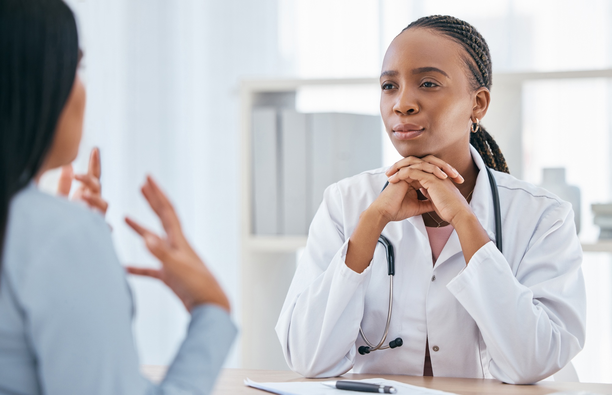 Doctor, medical and healthcare consultation of a black woman health worker with a patient. Consulti